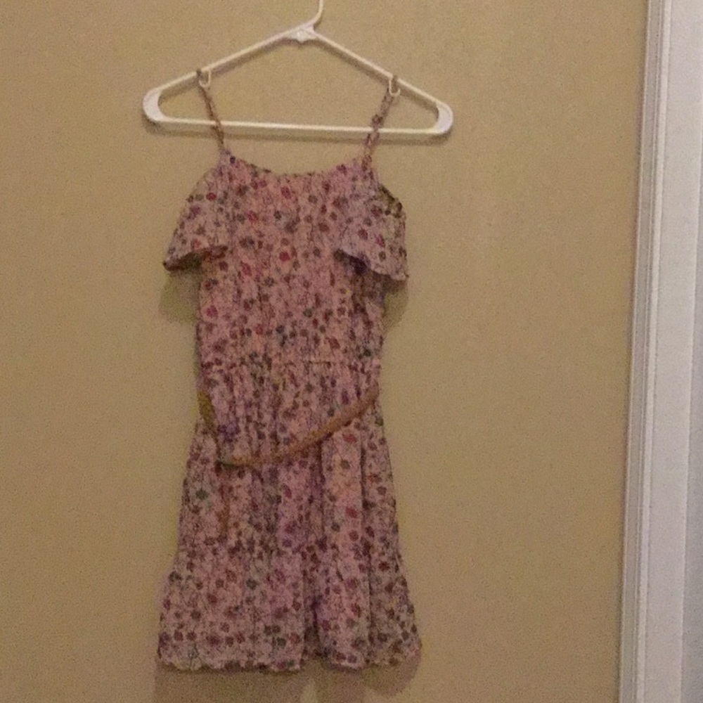 A pink floral dress with belt